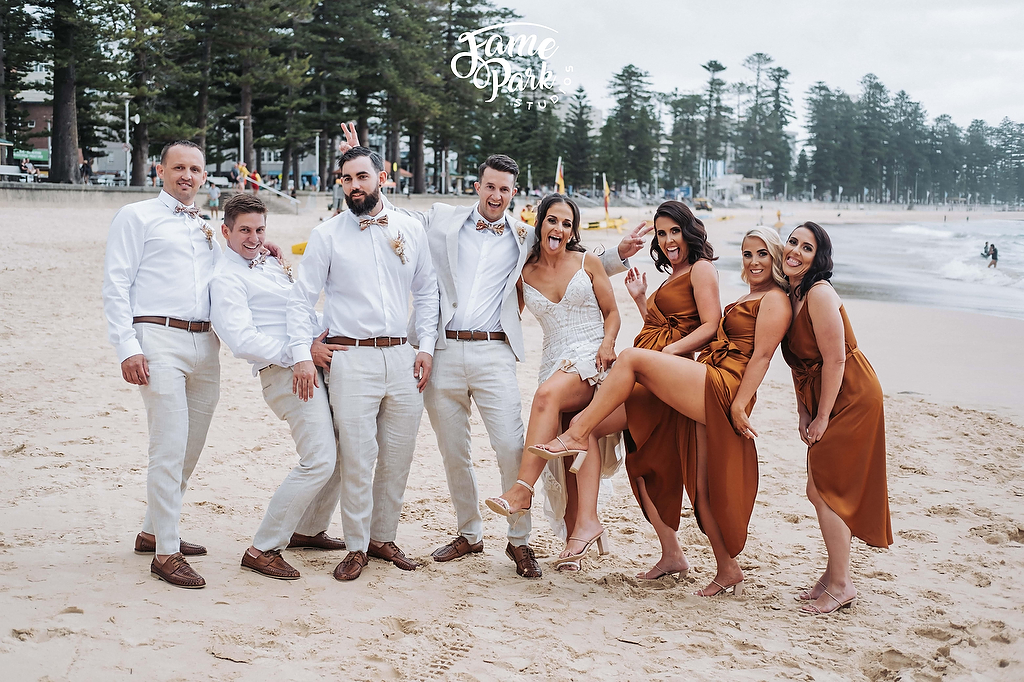 A fun and candid wedding photo on the beach