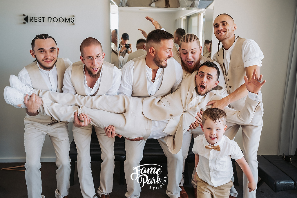 Fun and Candid photos for groomsmen with their suits.