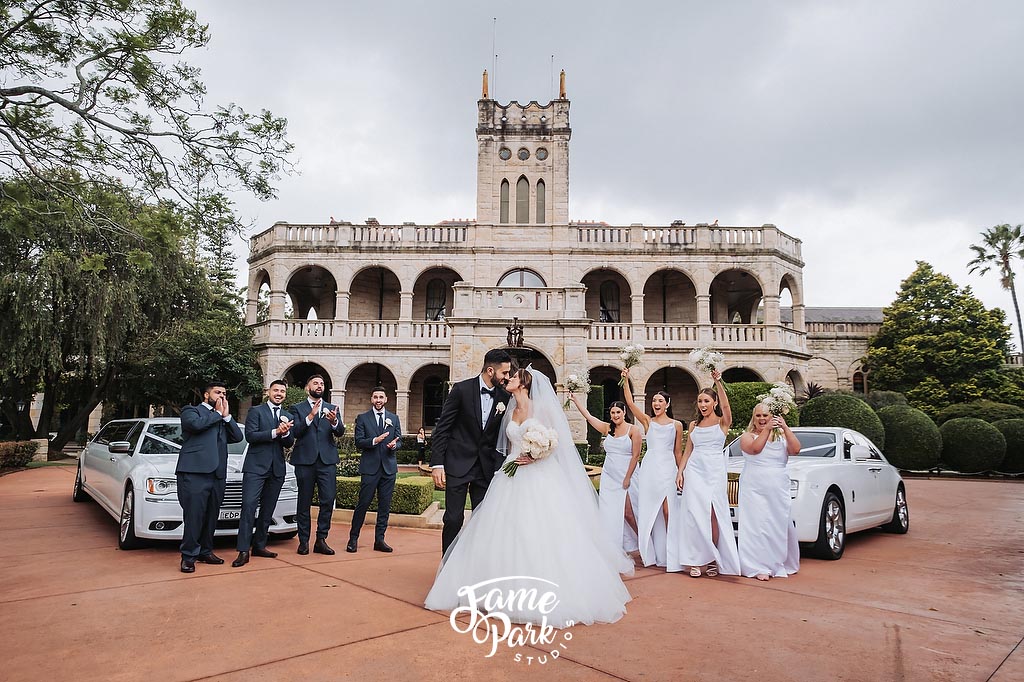 A full bridal party photo in front of the Curzon Hall