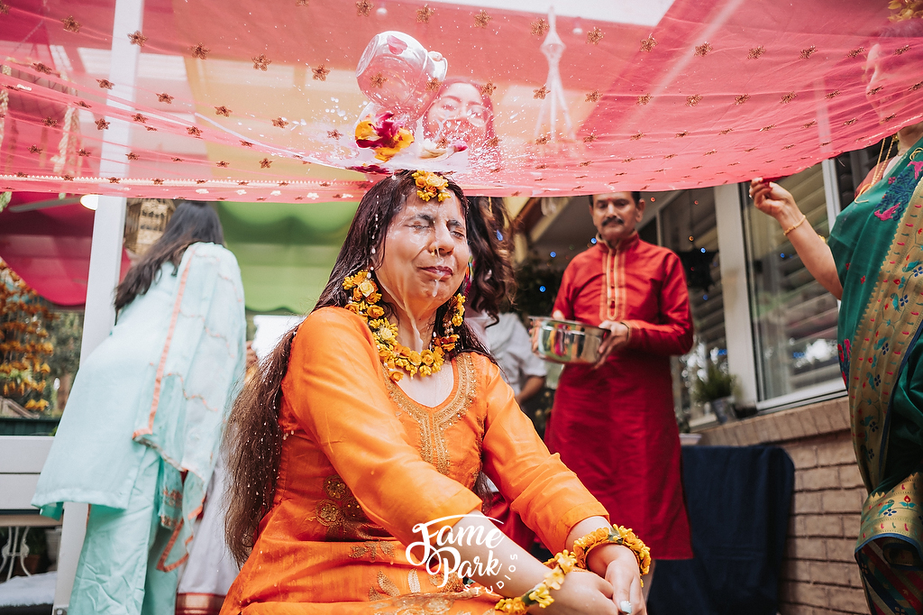 The Indian bride is having her Haldi ceremony before her wedding day.