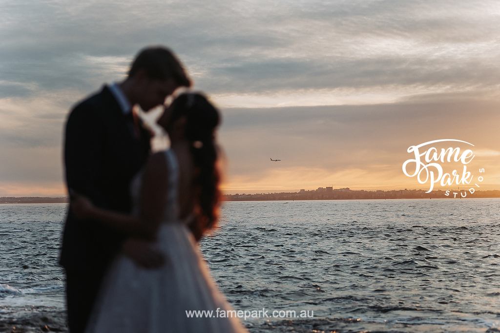 A beautiful silhouette photo of the bride and groom during the sunset hours