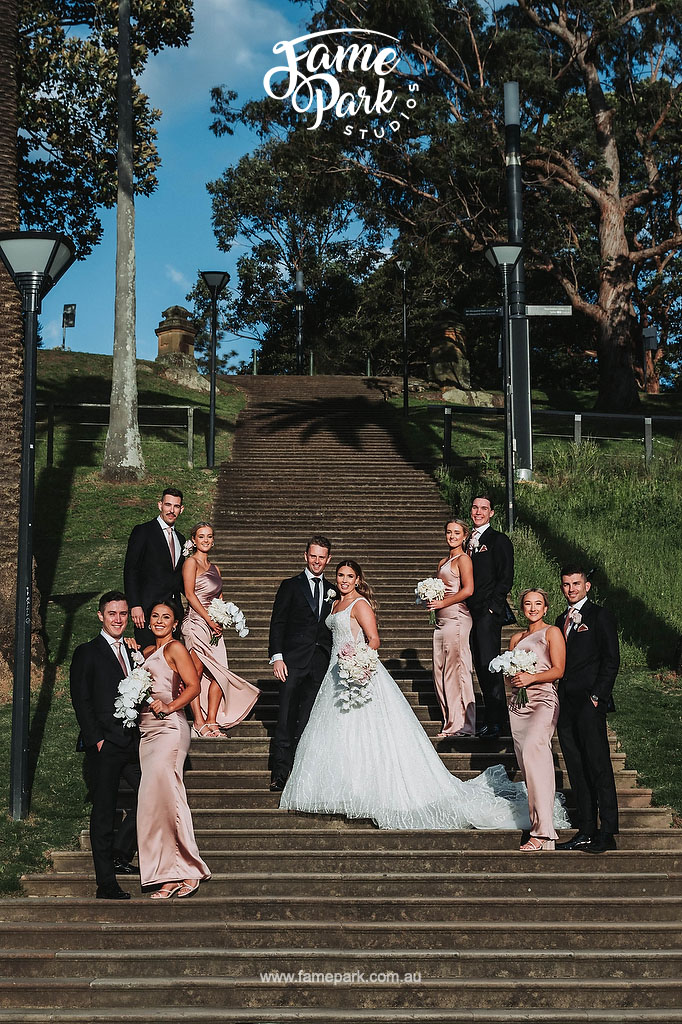 A signature group photo of bridal party on the stair of Royal Botanic Garden Sydney