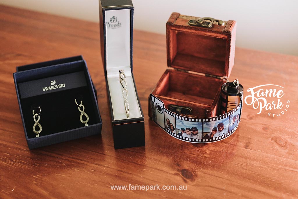 A wedding gift idea for a bride-to-be – earrings presented in a decorative box on a table.