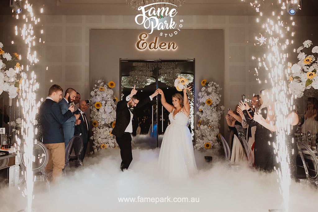 A bride and groom lighting up their wedding reception with sparklers at Eden venues
