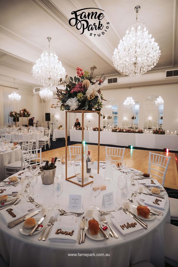 A wedding reception with elegant table decor.